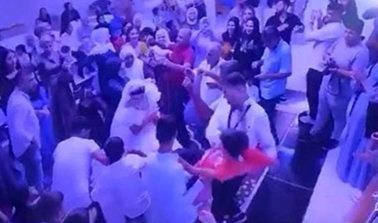 Damat gelinliği çekiştiren çocuğu yere fırlattı